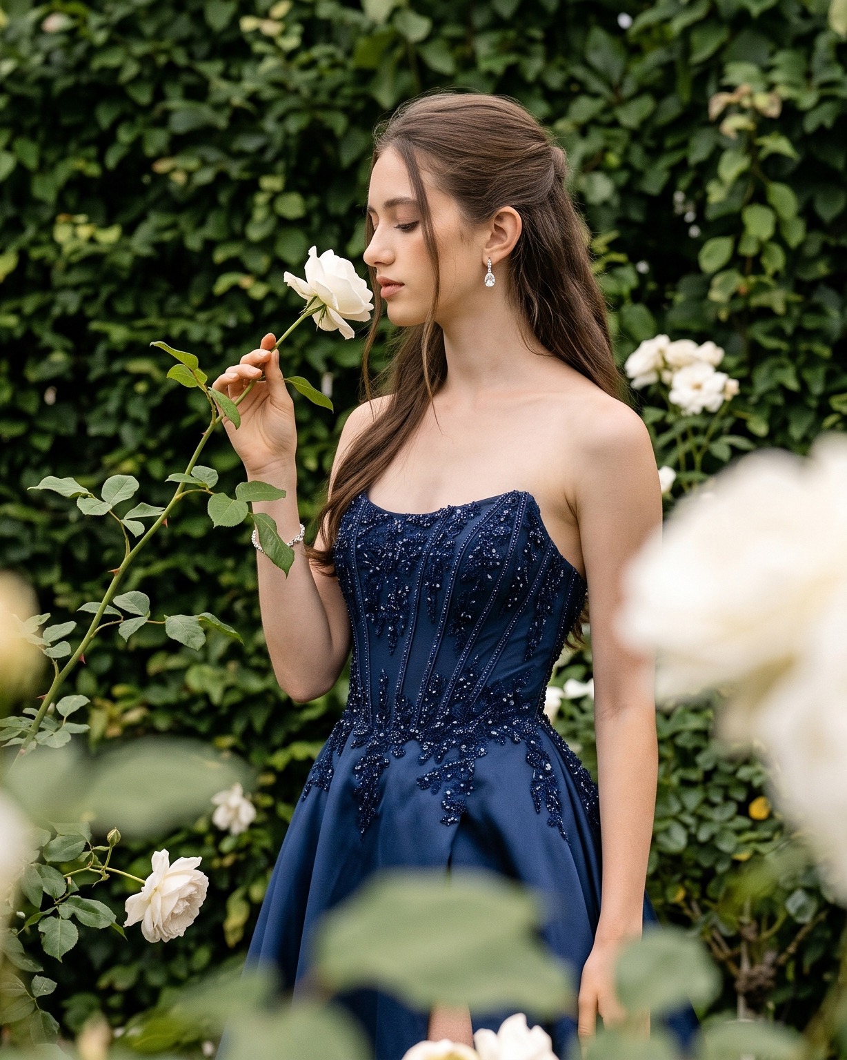 Navy embellished Gino Cerruti prom dress in a rose garden